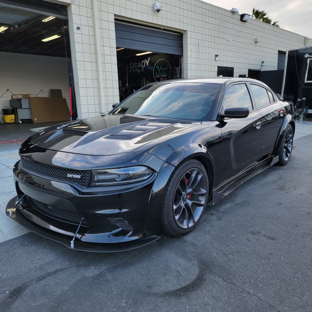 Black Dodge Charger Daytona full wrap inside the 360 Innovation Wraps install bay