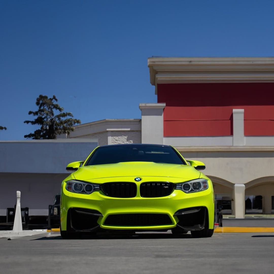 Neon lime green BMW M4 full color change wrap, front view