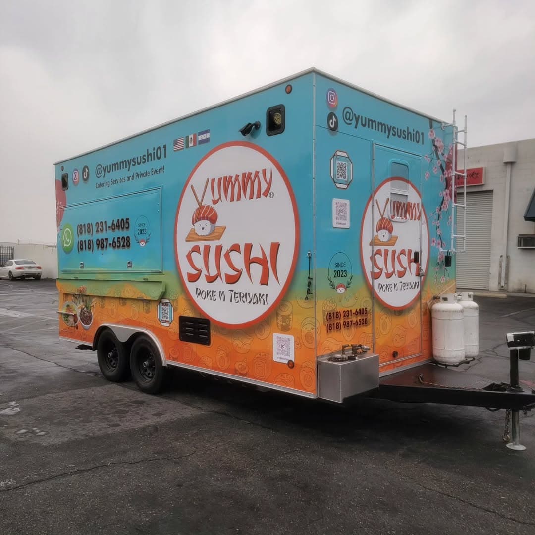 Yummy Sushi food truck wrap with vibrant teal and orange branding