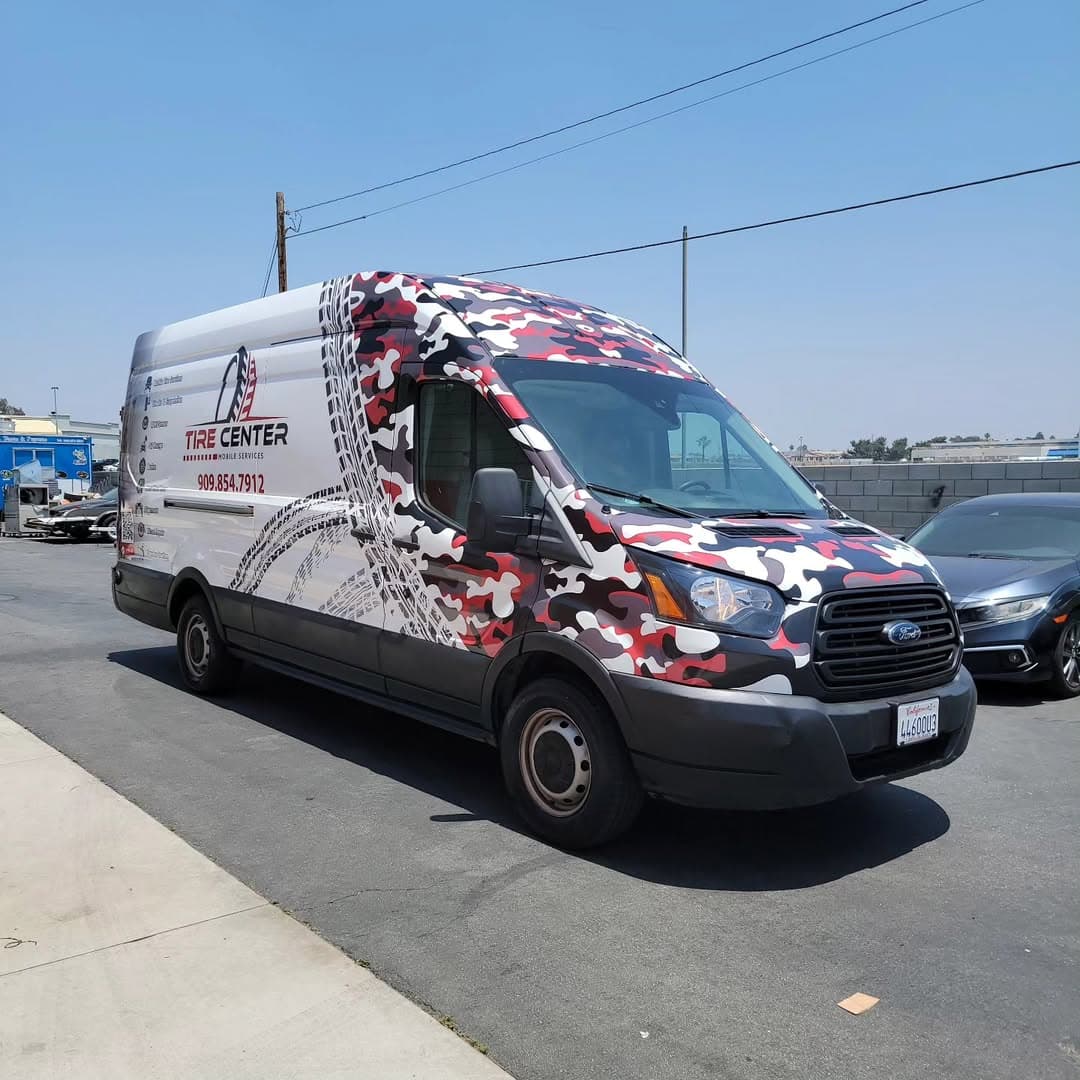 Tire Center mobile services Ford Transit van with red and black camo wrap